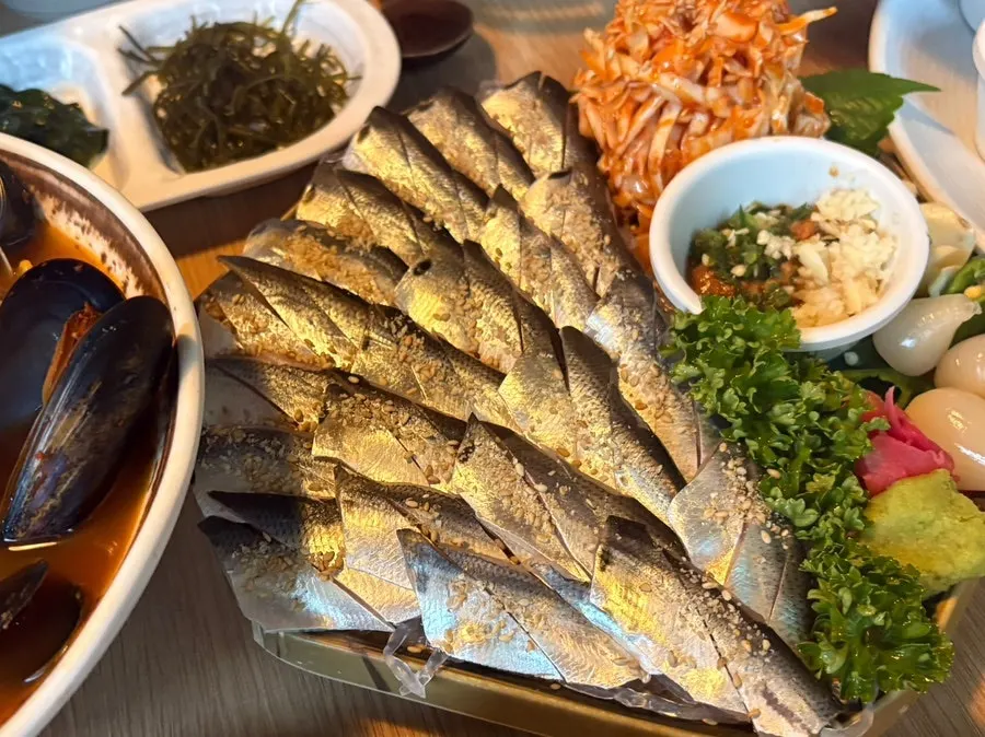 A soft, rich piece of aged blue-fleshed fish sashimi