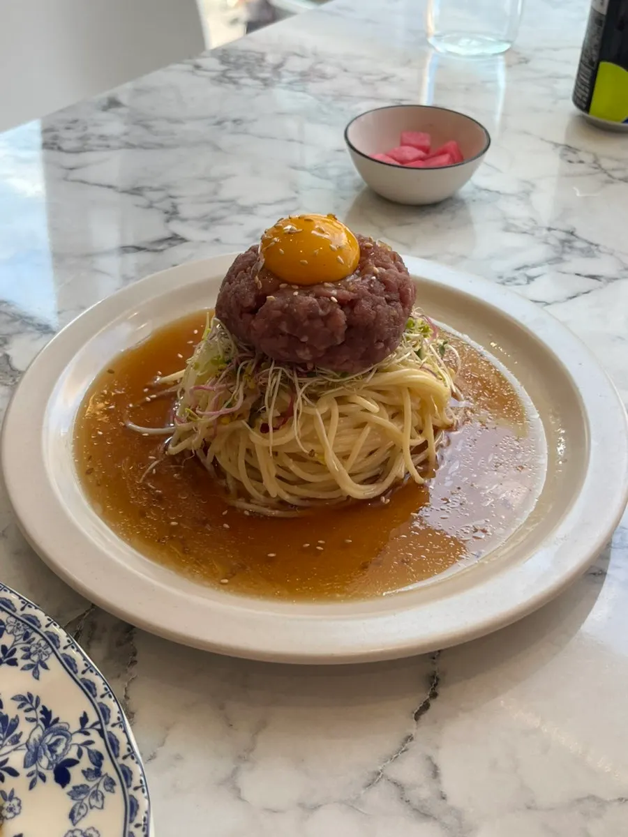 A plate of perilla oil beef tartare pasta at Palette Hannam
