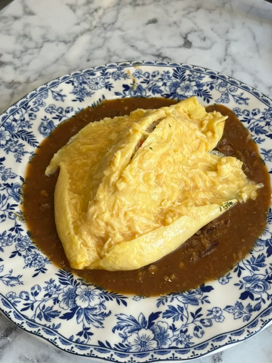 Omurice egg cut open with a knife