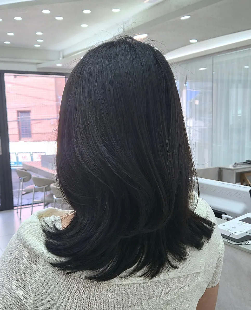 Layered C-curl style completed after the repair perm