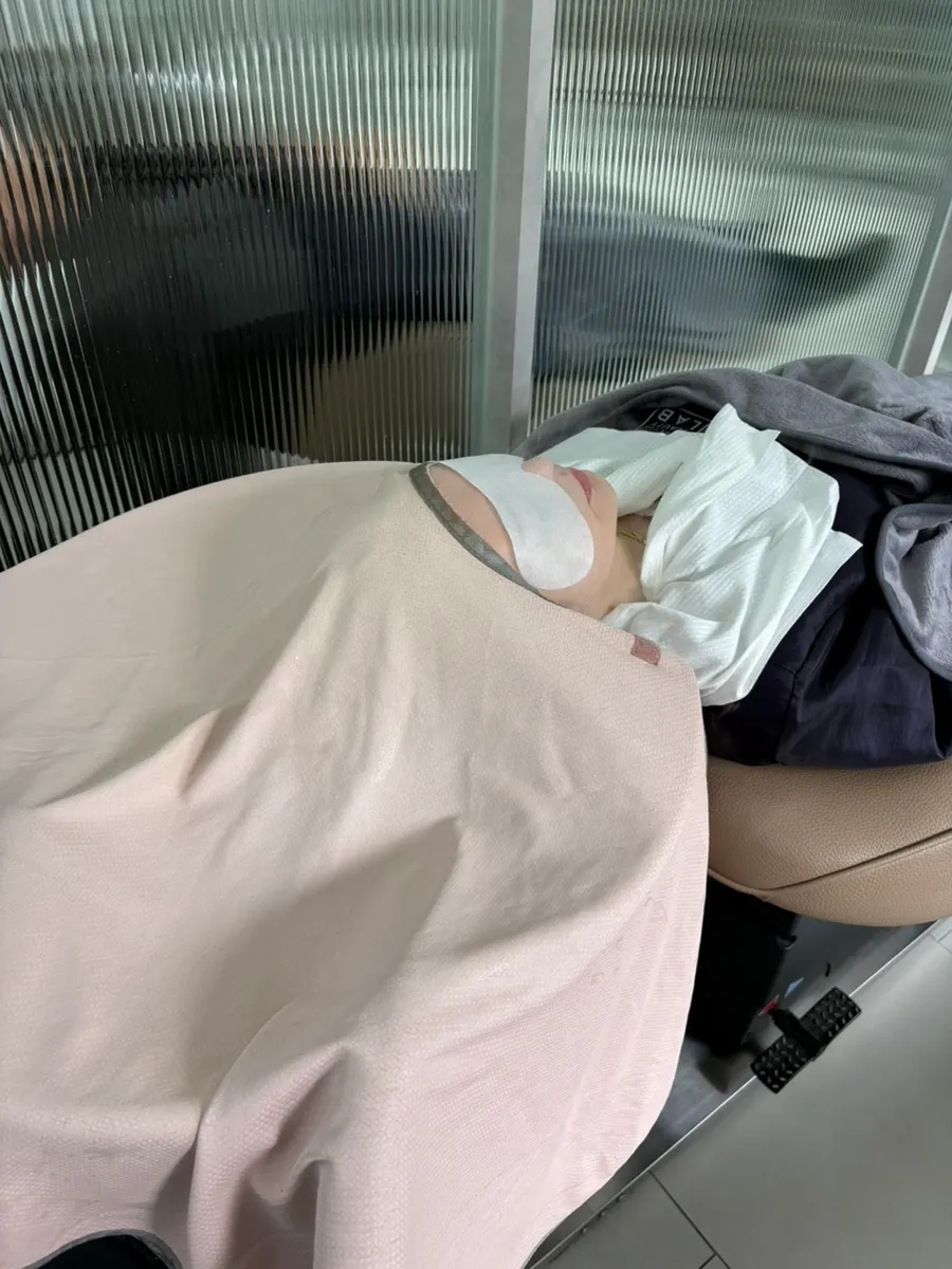 Receiving the treatment while covered with a blanket
