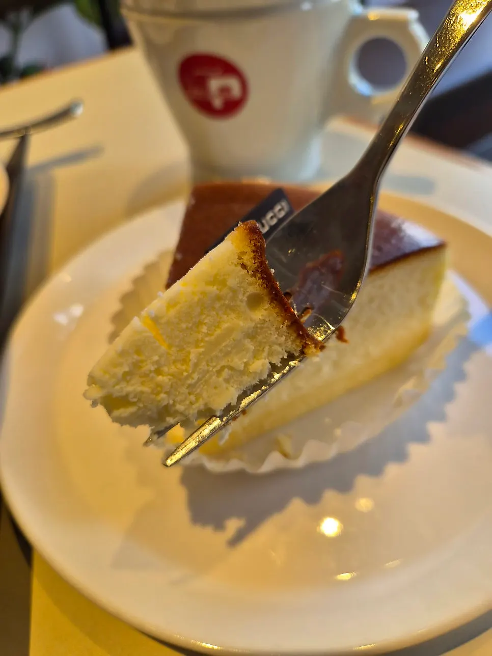 Two dessert plates and coffee together at the table