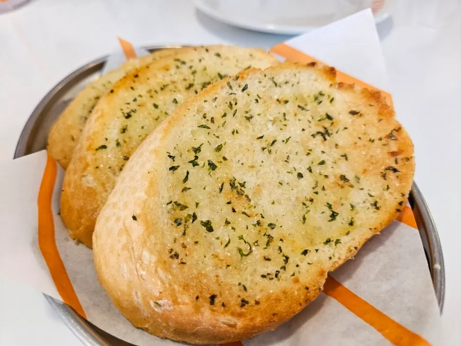 Close-up of the pre-meal garlic bread on a plate