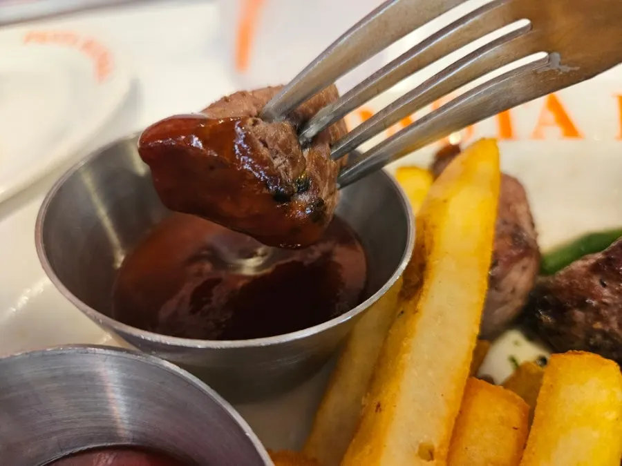 Skirt steak served with house-made barbecue sauce