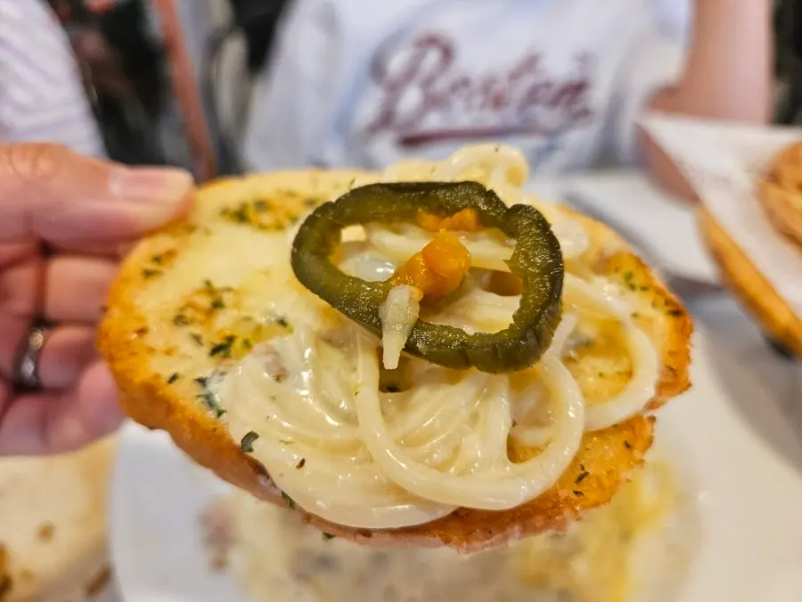 Cream pasta and jalapeño pickles piled onto the pre-meal bread