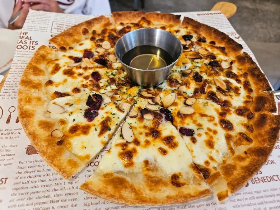 A whole thin-crust gorgonzola cheese pizza