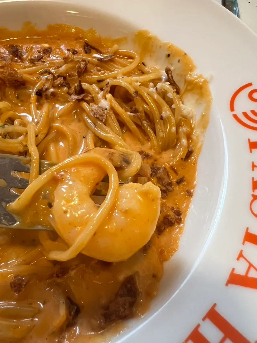 Two pasta plates set out for a family dinner