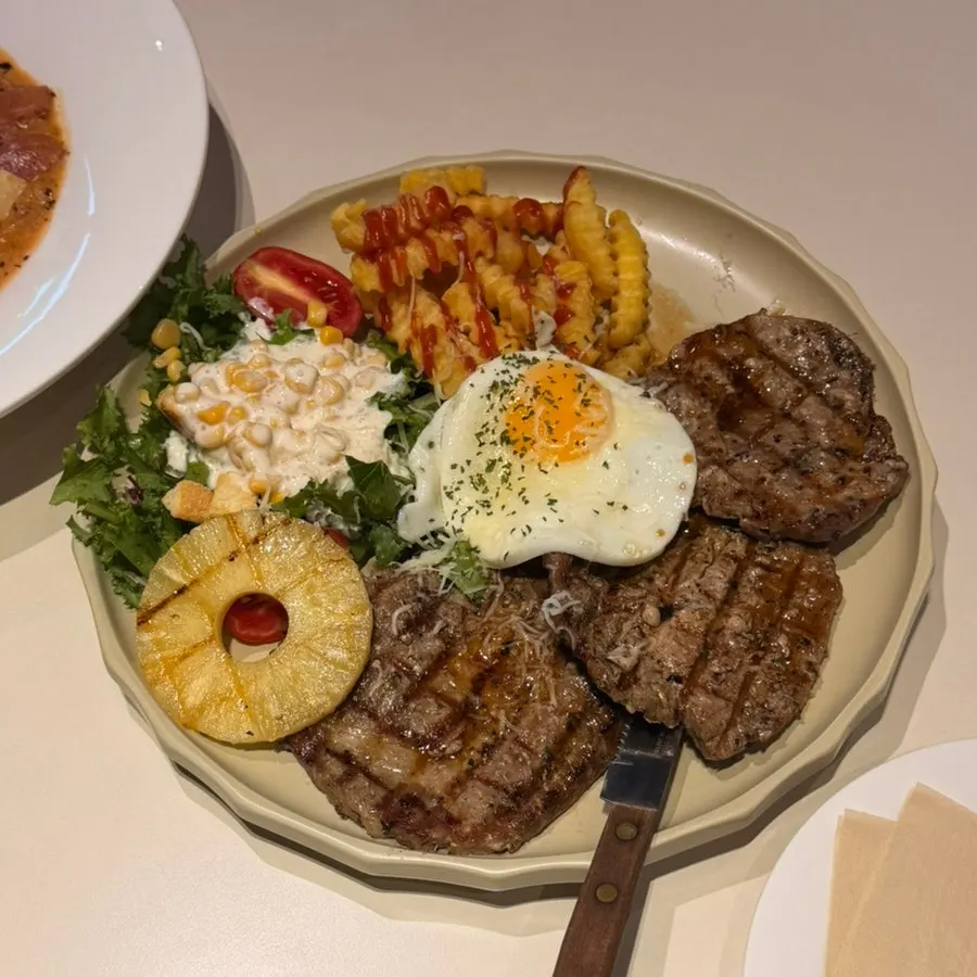 Plate of pork collar steak salad