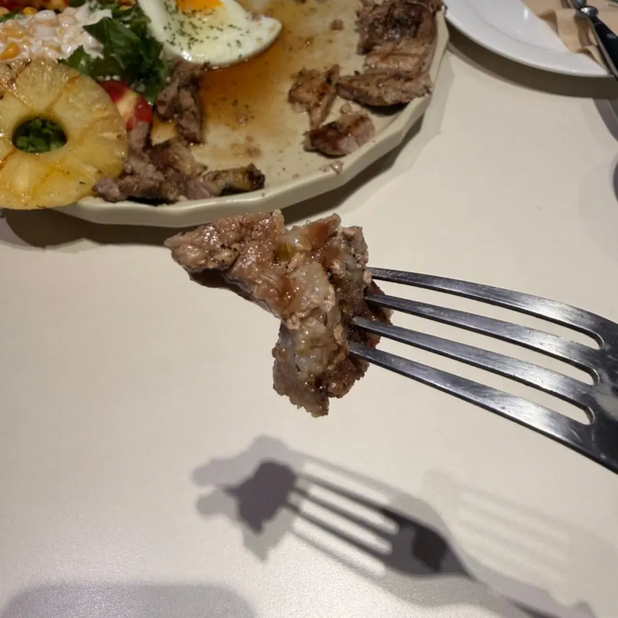 Pork collar steak served with fries