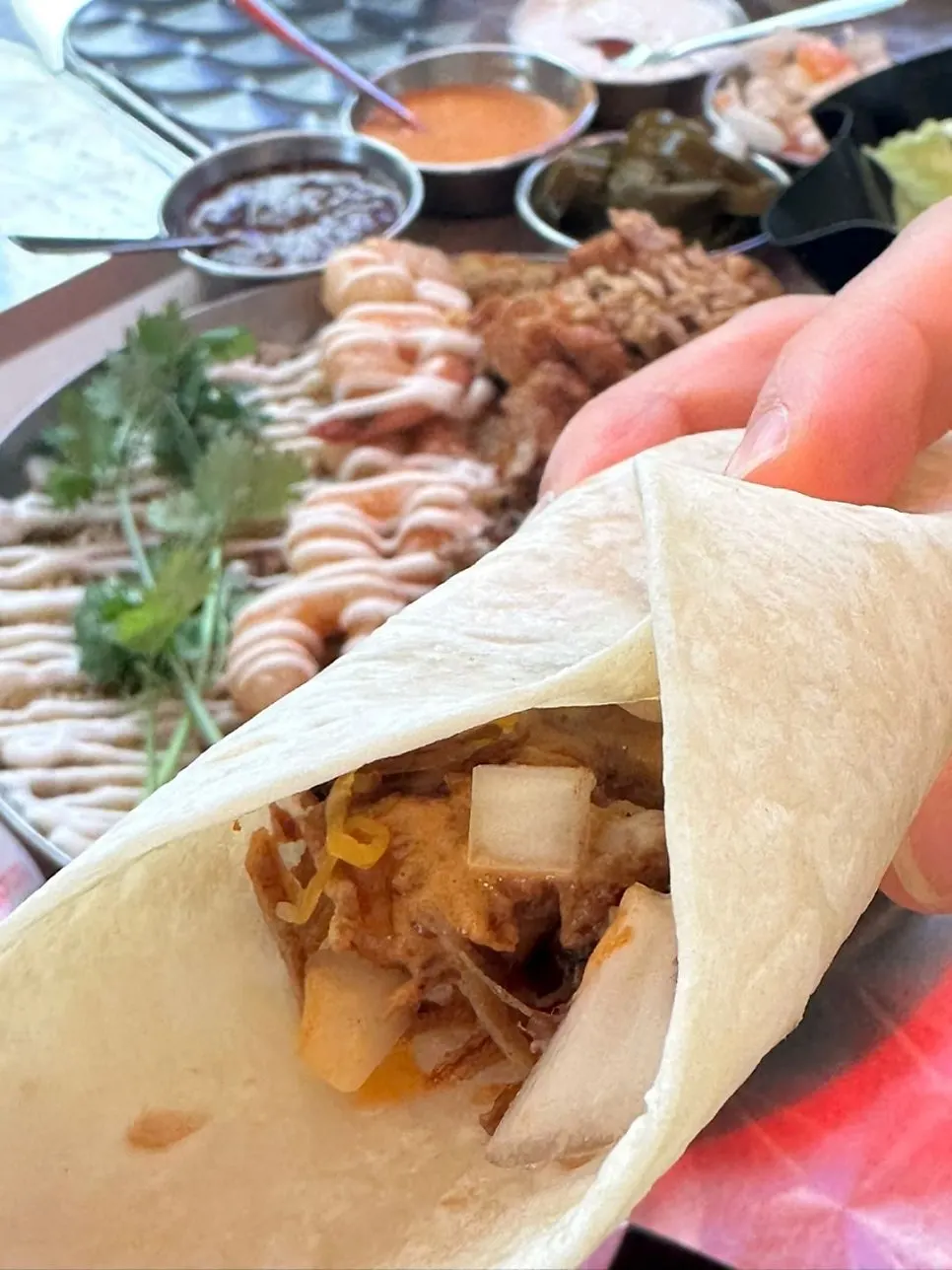 Fajita topped with chipotle chicken and carnitas