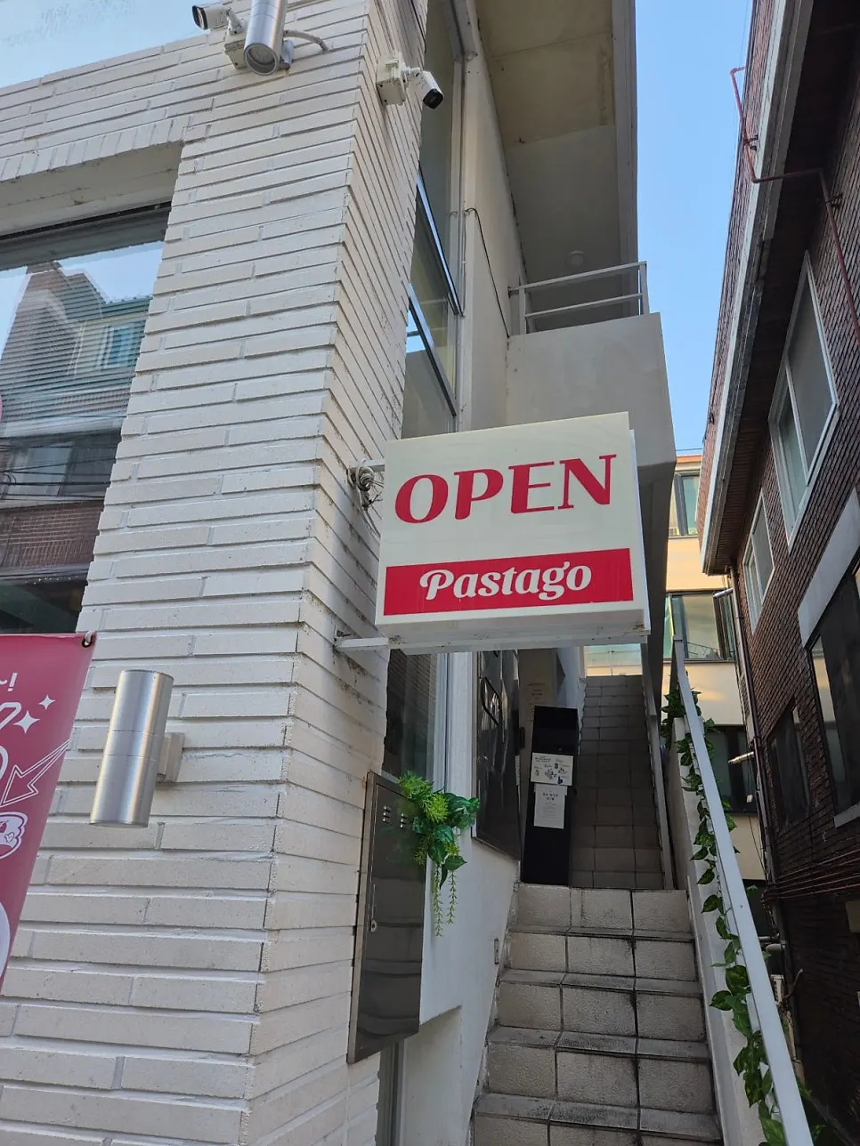 Interior of Pasta Go Hongdae Branch with generously spaced tables