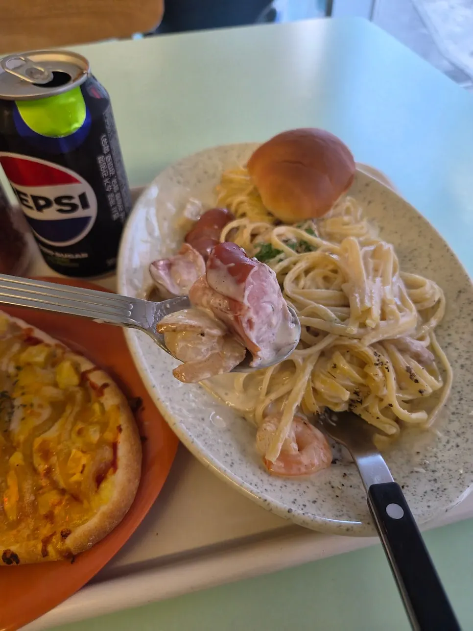 Garlic butter cream pasta plate near the end of the meal