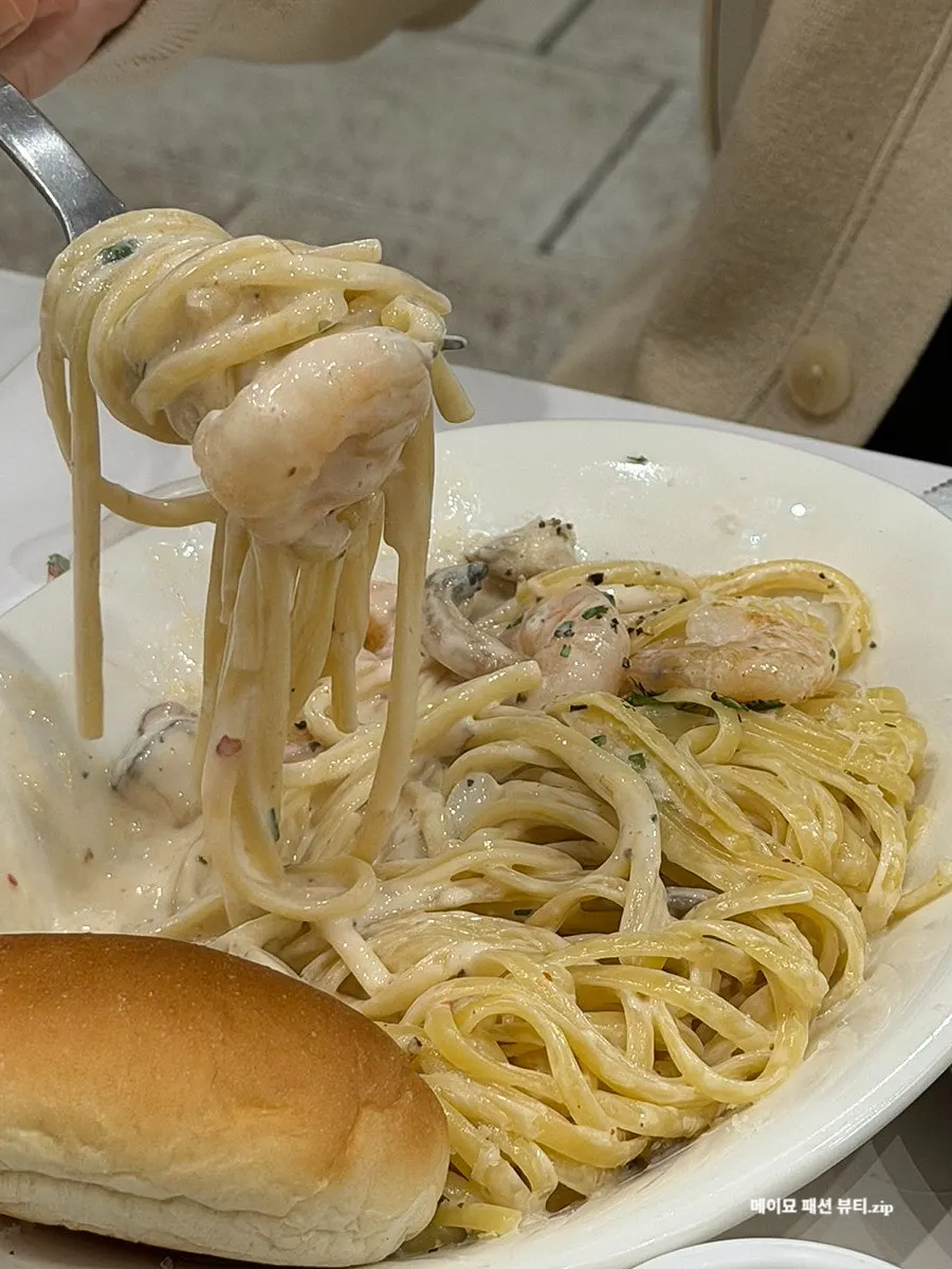 Garlic butter pasta twirled on a fork
