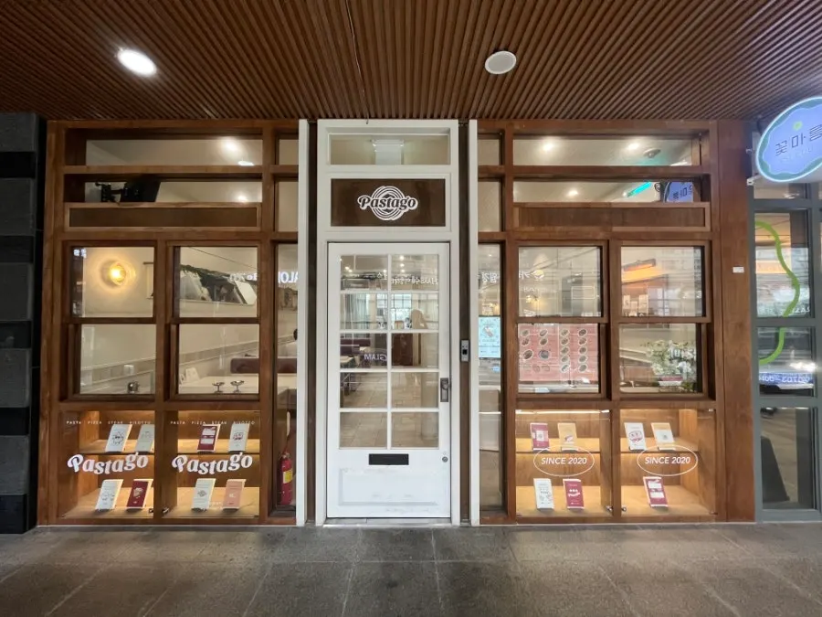 Store entrance with wood frame and white door