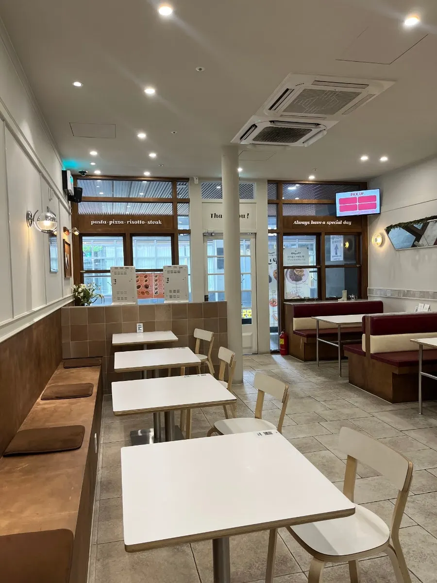 Interior seating in wood and white tones