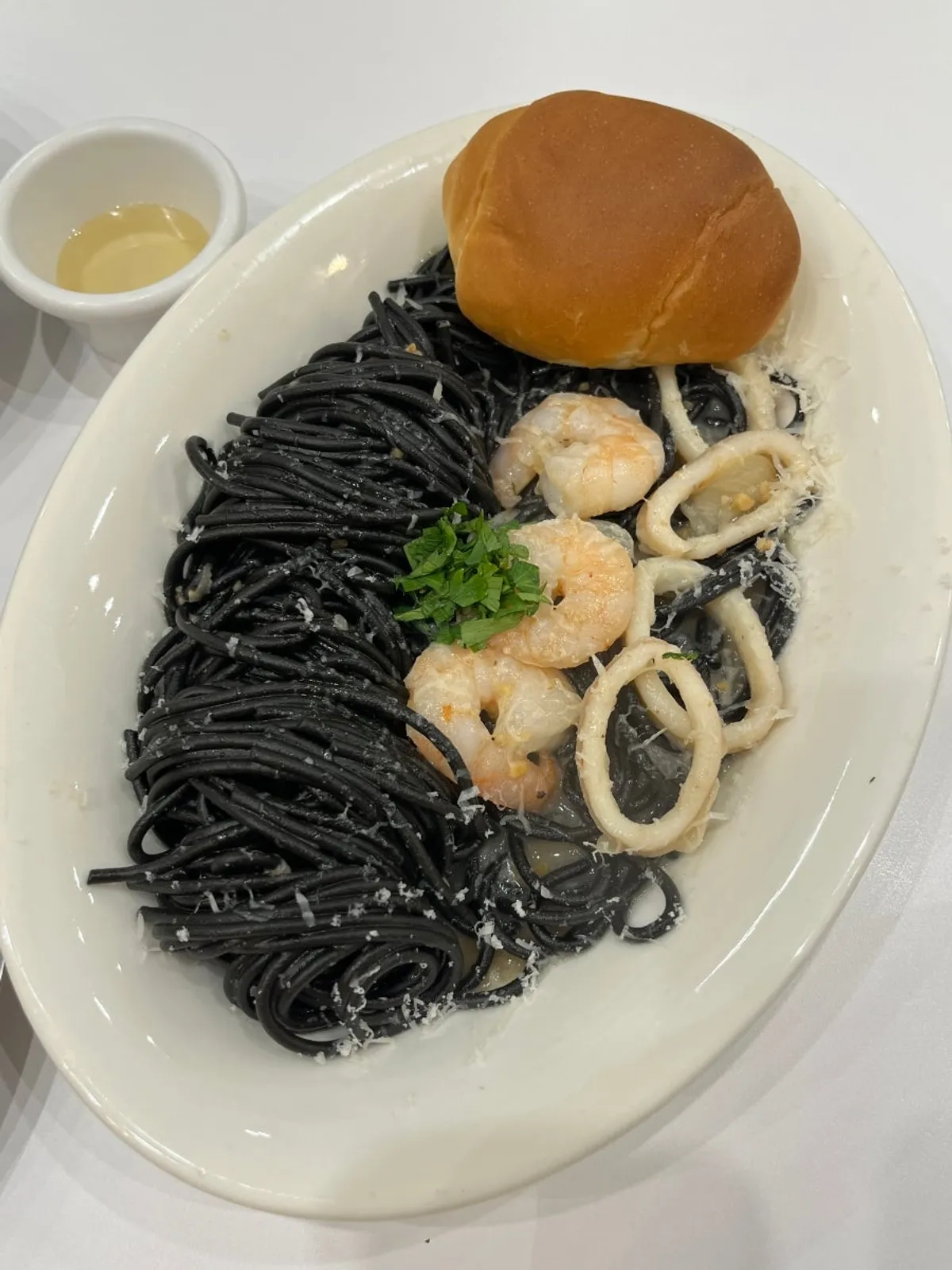 Special Black squid-ink pasta topped with shrimp and squid