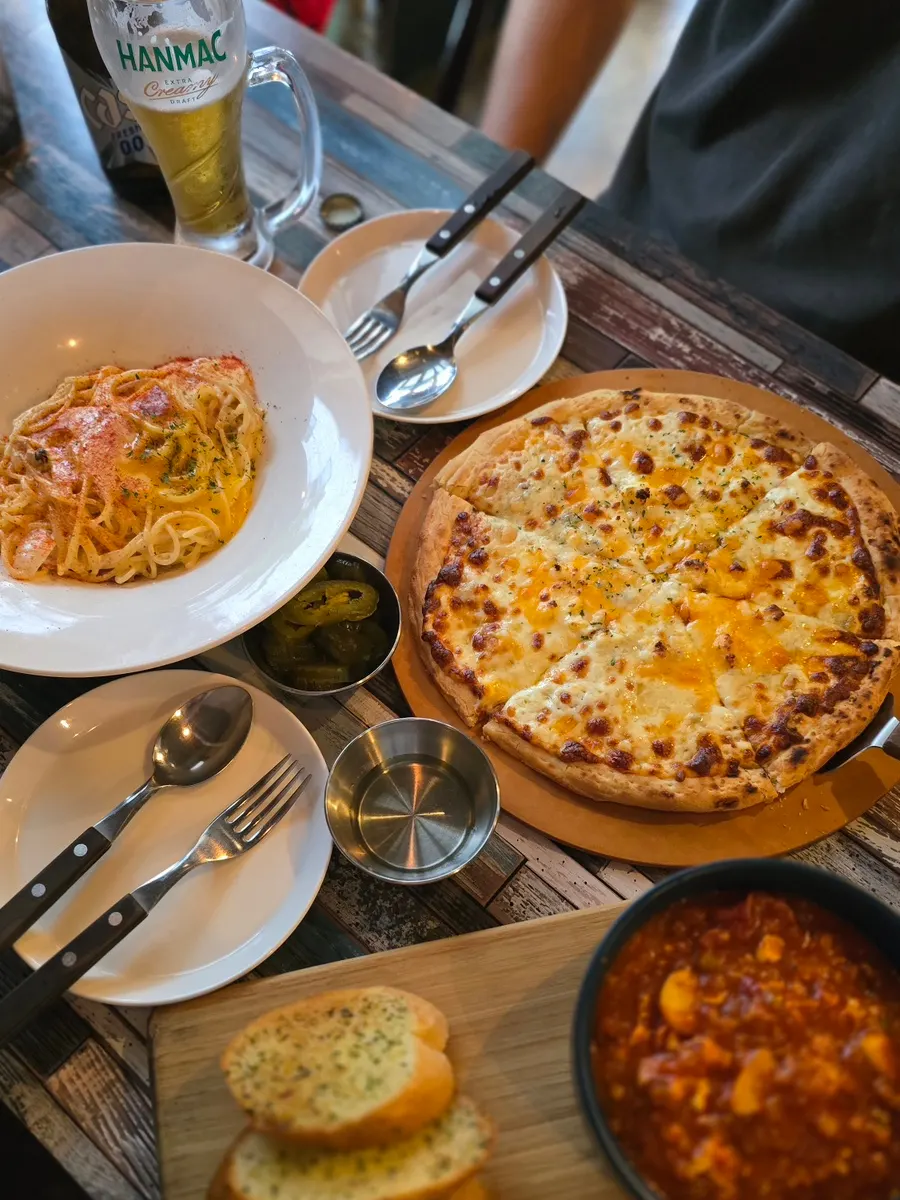 A spread of ₩10,000s pasta and ₩20,000s pizza