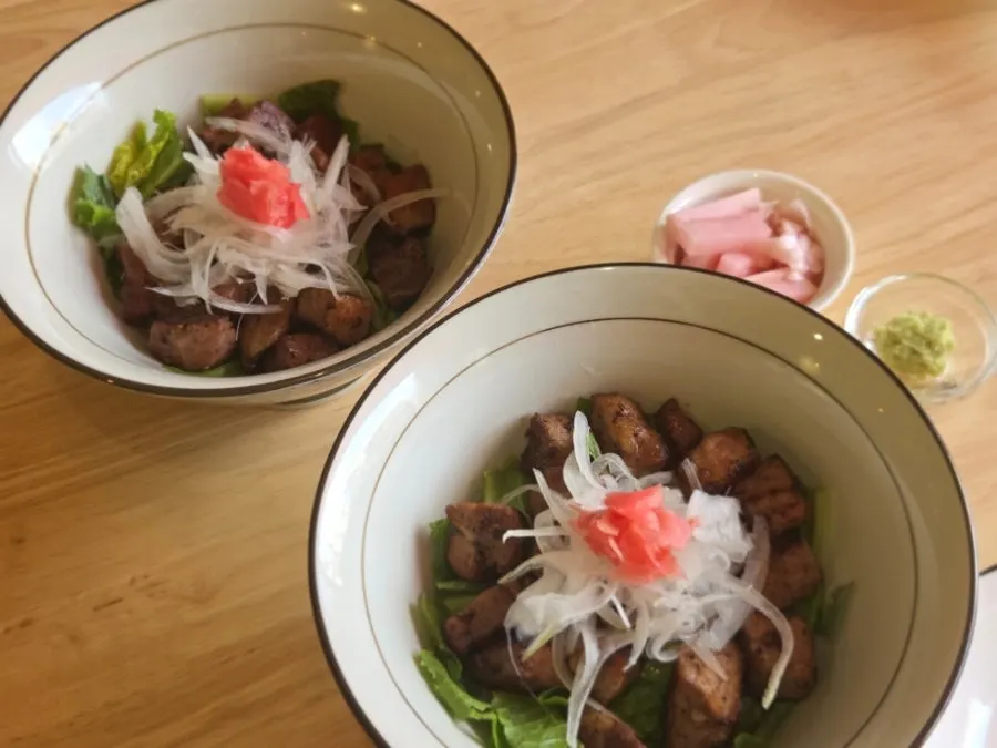 Cube steak bowl topped with thick pieces of meat