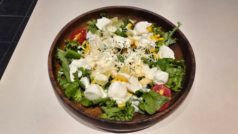 A bowl of ricotta cheese salad