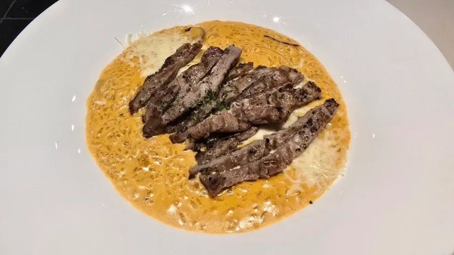 A plate of toowoomba risotto topped with pork jowl