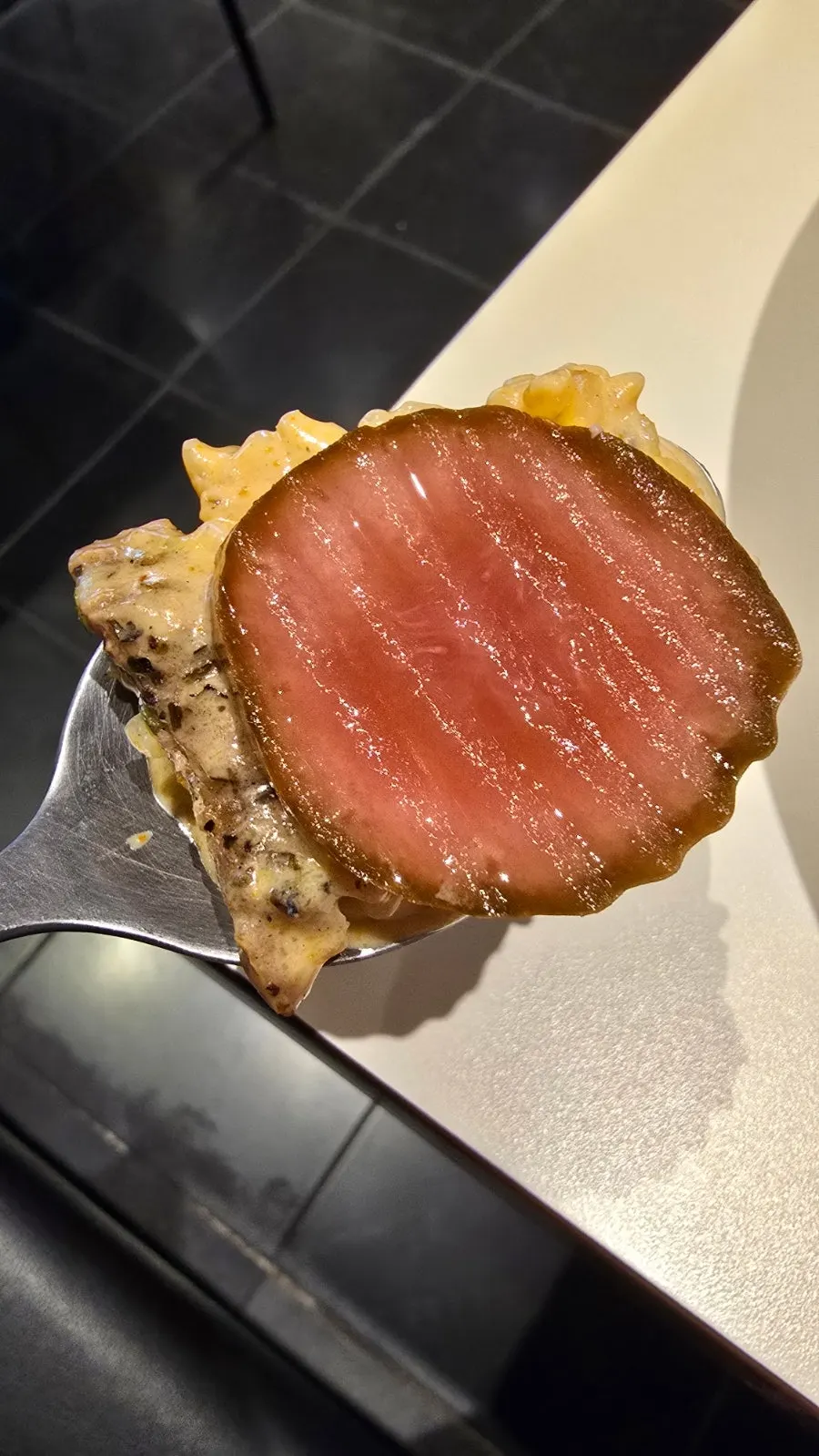 Picking up a piece of grilled pork jowl
