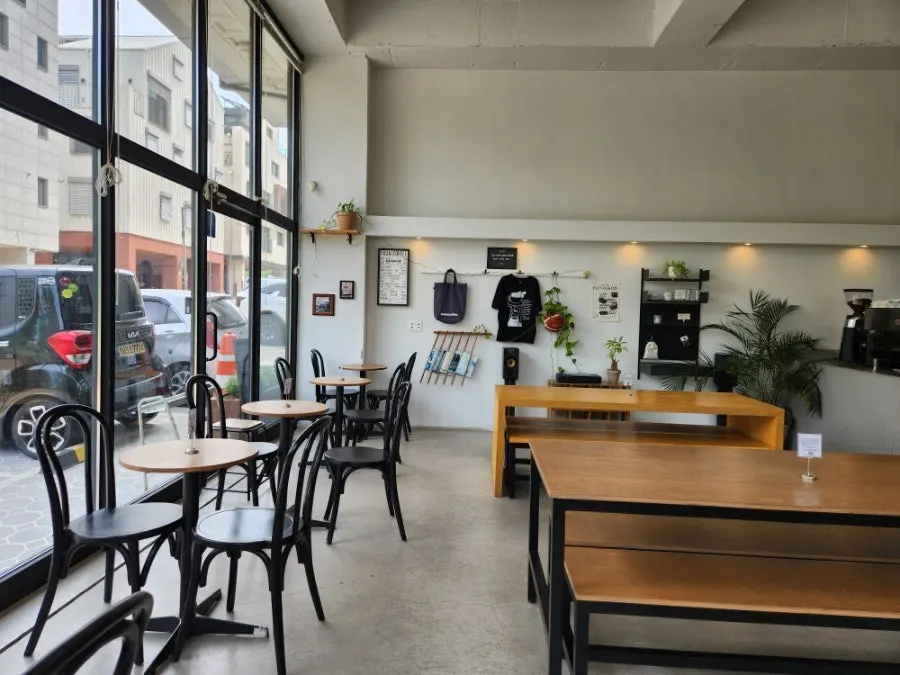 Café seating in white and wood-toned interior