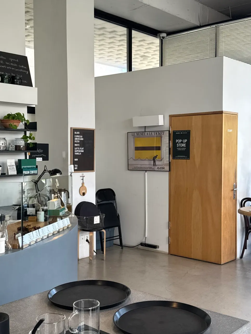 Café interior with a forest park view through the window