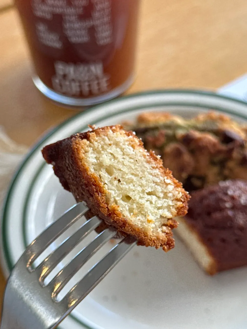Financiers next to an iced Americano