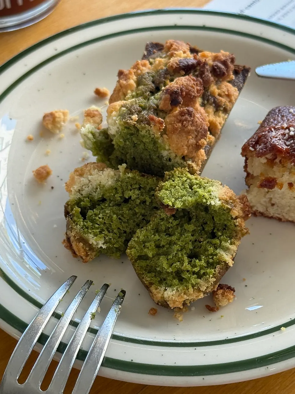 A financier with a bite taken out of it