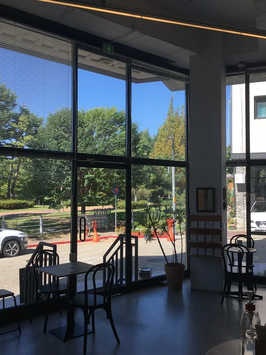Large windows letting in sunlight and high ceilings