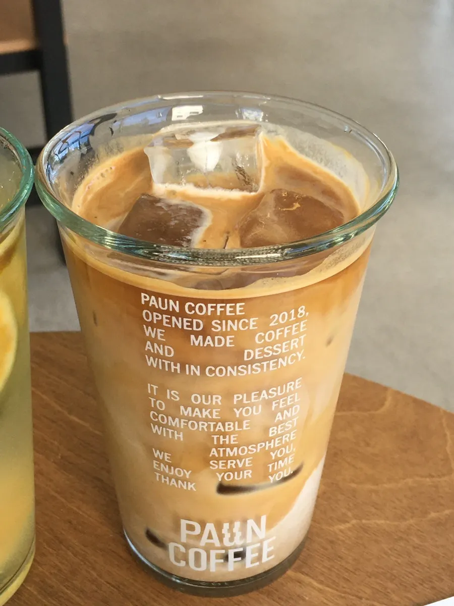 Iced latte, green tangerine ade, and two financiers