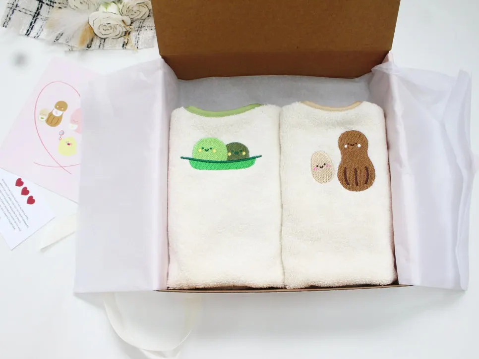Opened box showing the 2-piece Wash Bib set