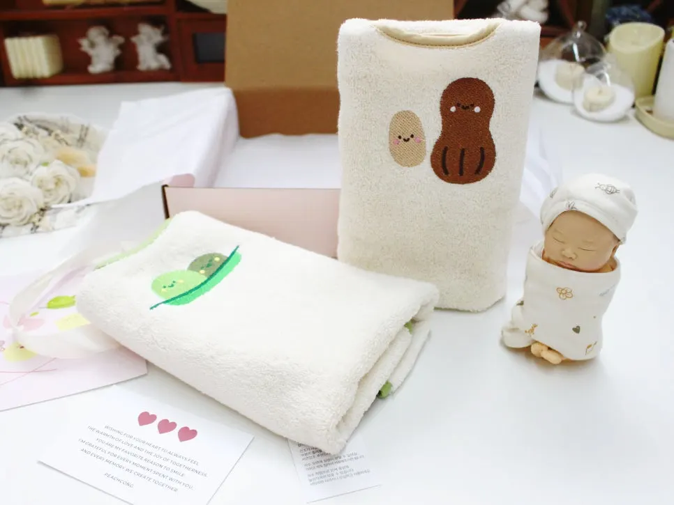 Styled photo of the Wash Bib set prepared as a baby shower gift