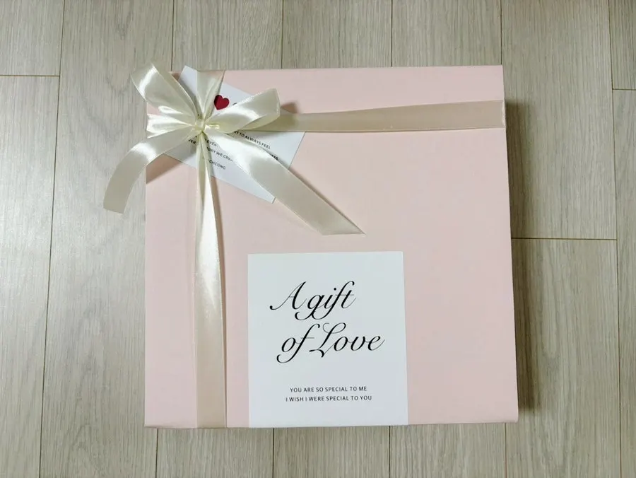 Pink gift box and message card