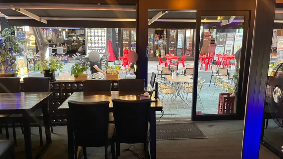Indoor seating with subdued lighting at People & Peoples