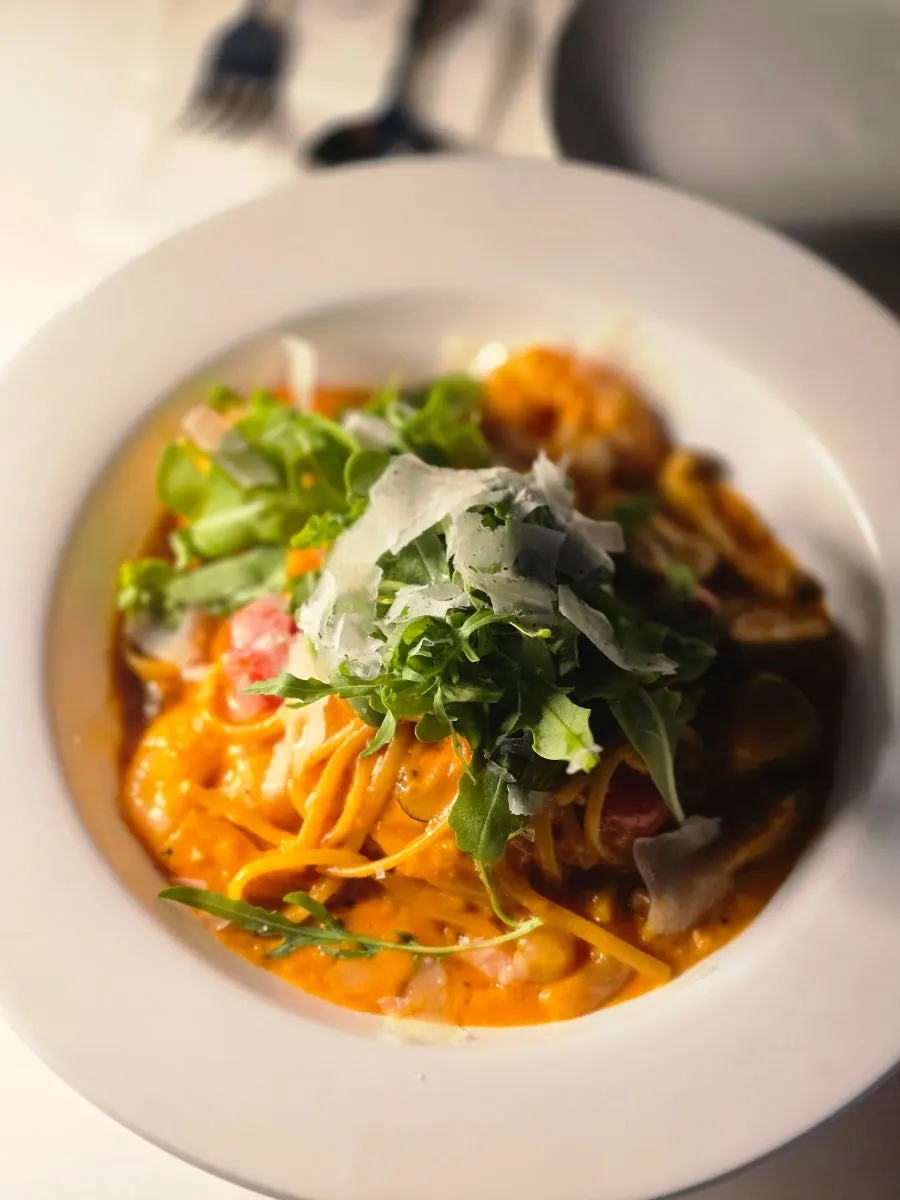 Rosé pasta topped with shrimp and grilled mixed mushrooms