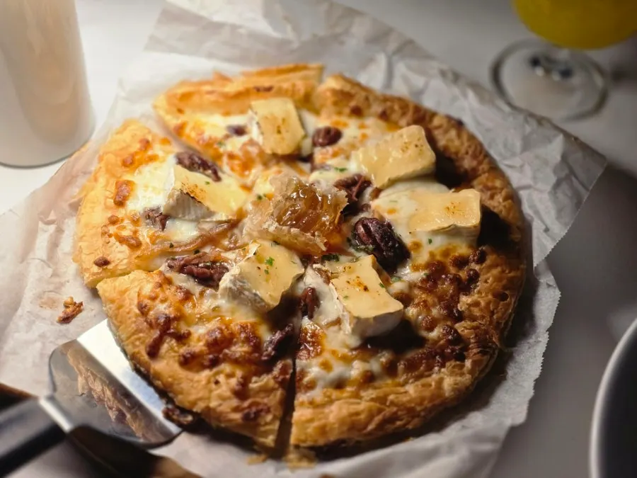 Pastry pizza placed on the terrace table