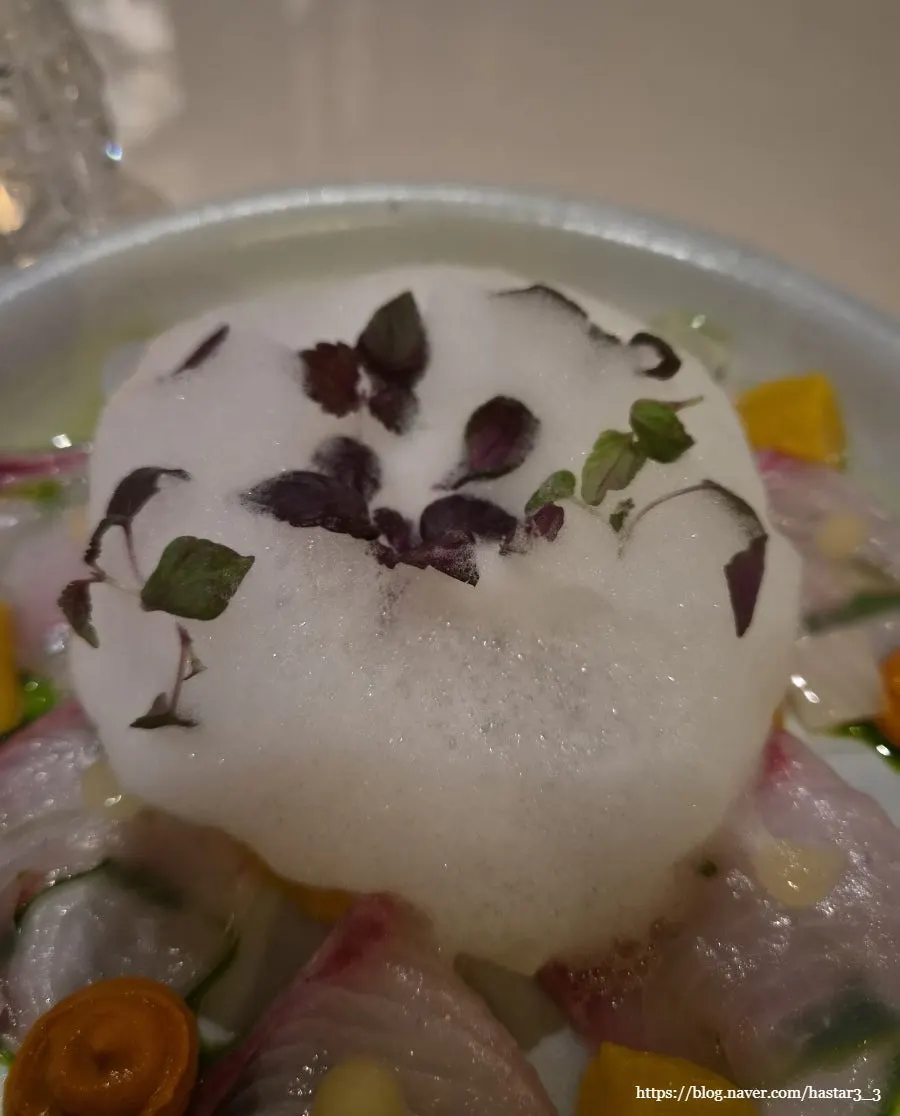 Amberjack ceviche topped with tomato foam