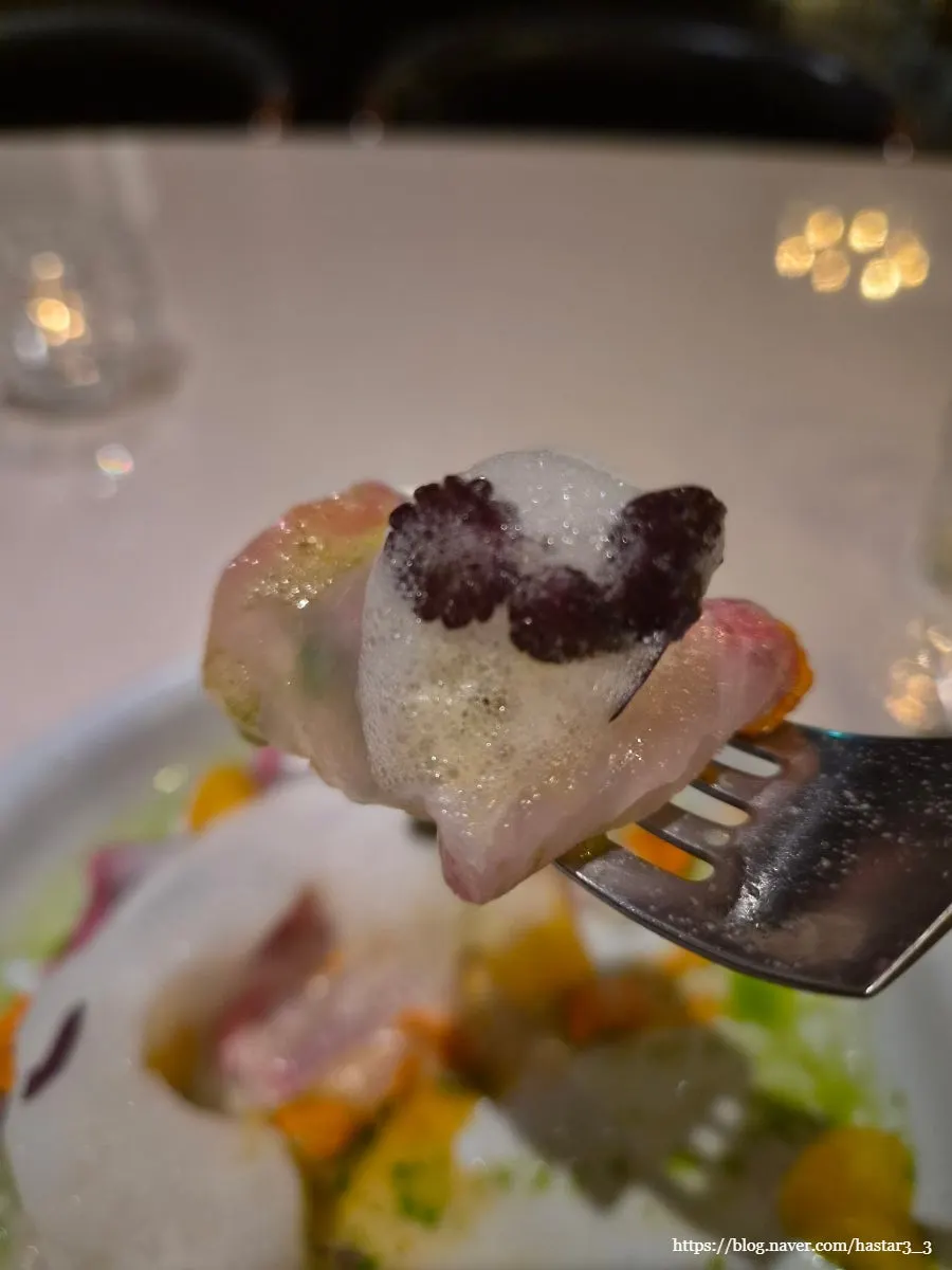 A bite of amberjack with sauce
