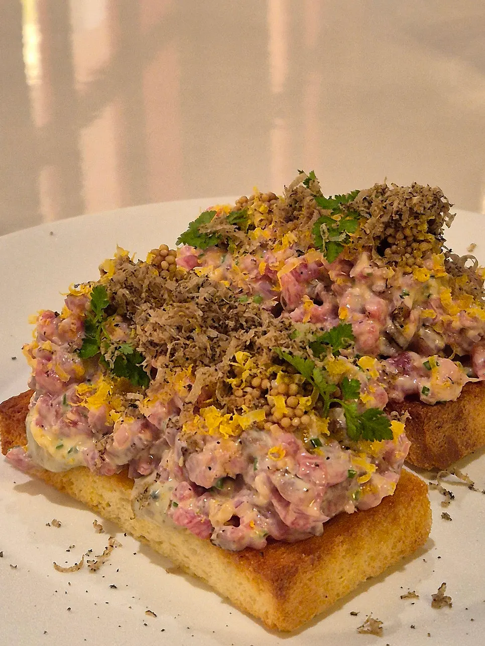 Korean beef ggurit-sal tartare topped with black truffle