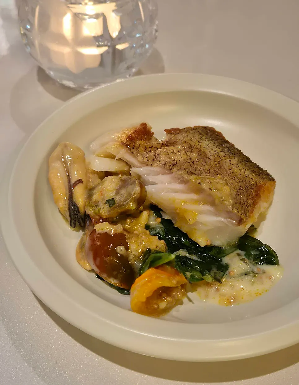 A plate of the main dish, cod steak