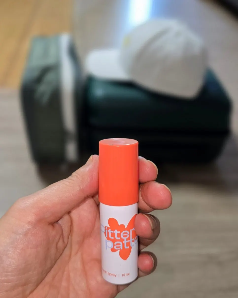 Mouth spray carried in a pouch