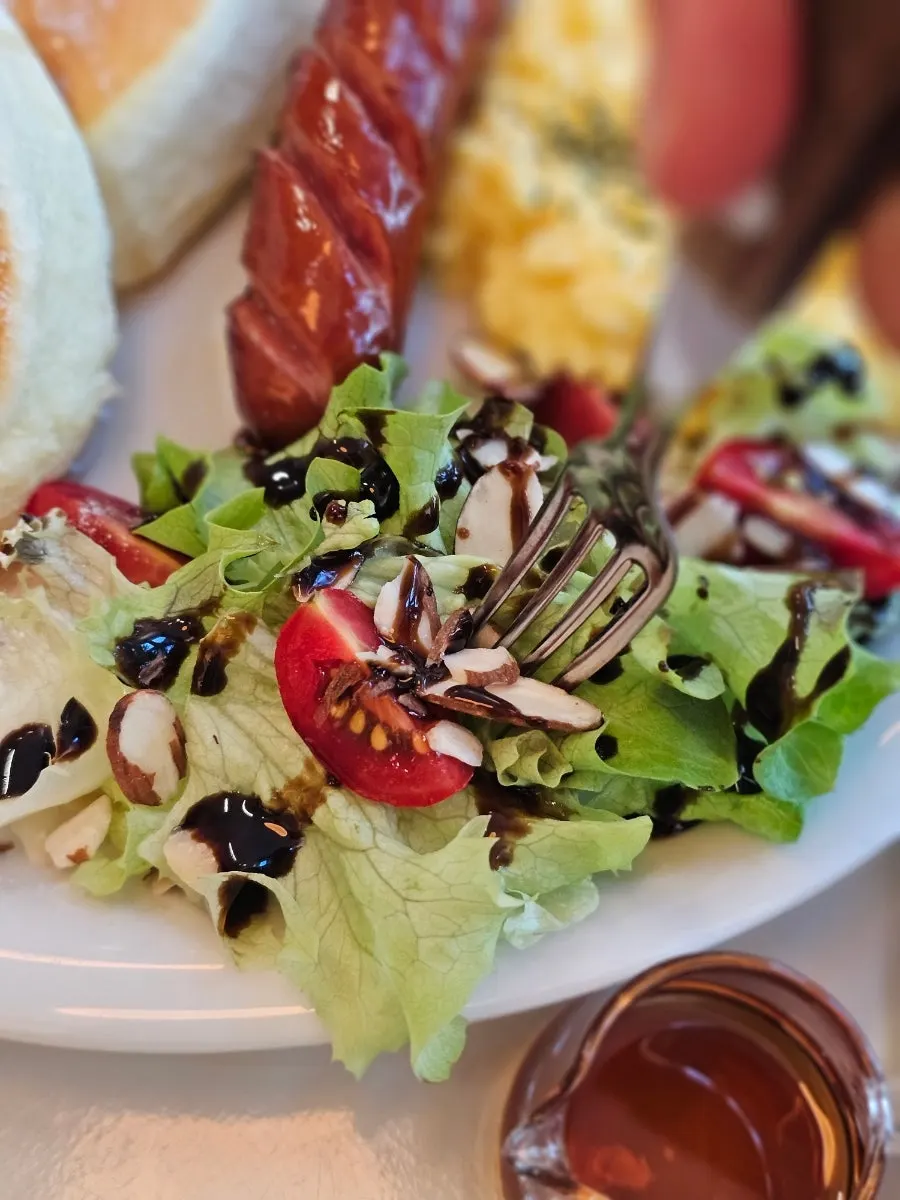 Salad drizzled with balsamic sauce