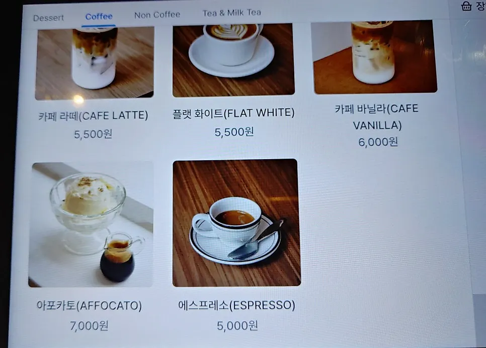Menu board listing coffee items
