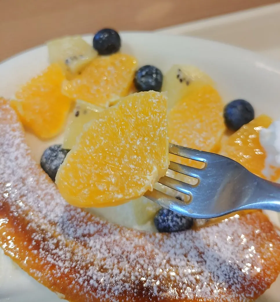 Soufflé pancake drizzled with maple syrup