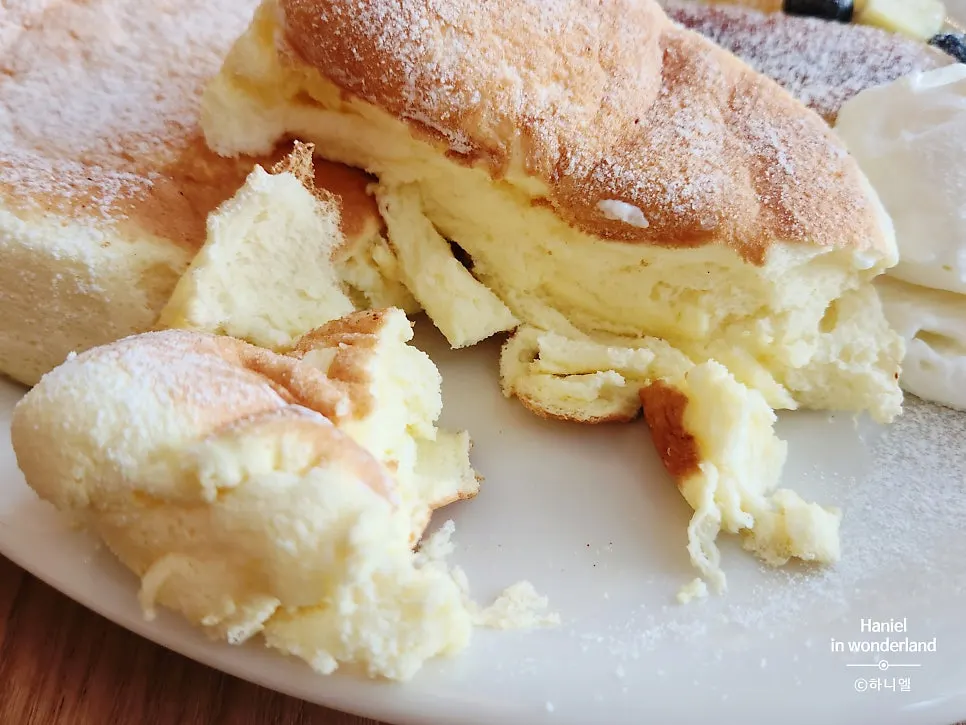 A piece of soufflé dipped in whipped cream