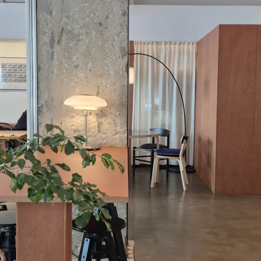 Interior seating at Petrico with wooden two-seat tables
