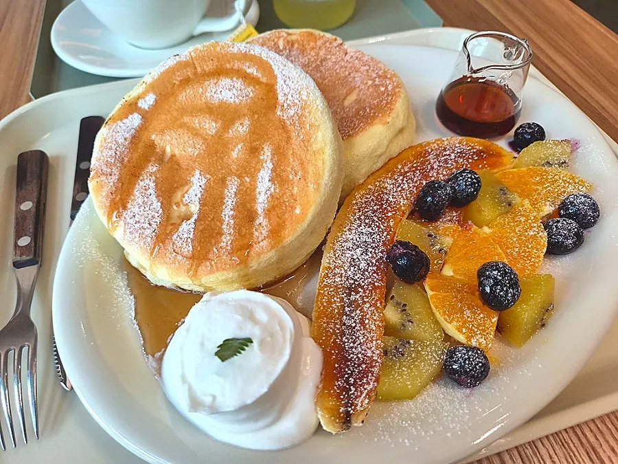 Drizzling maple syrup over the fruit soufflé