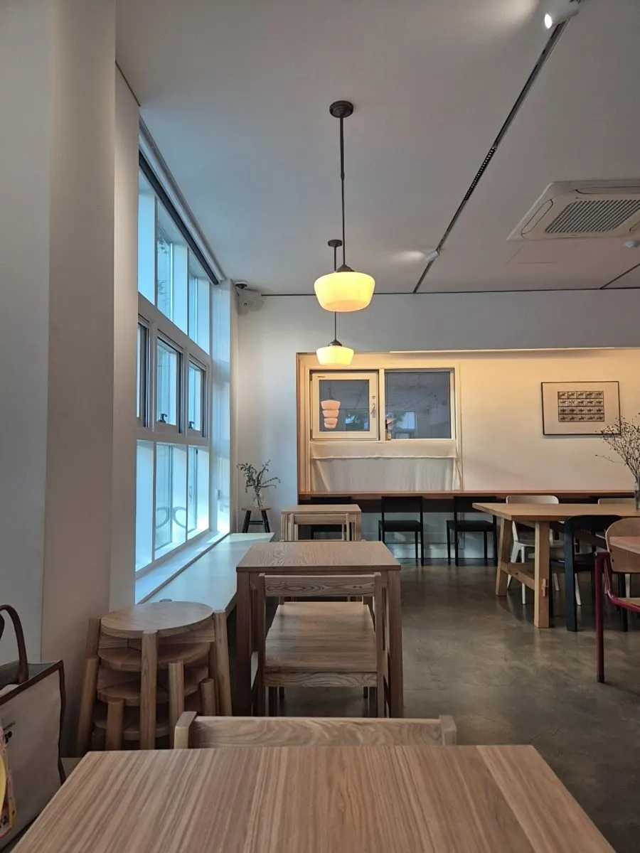 Interior of Petrico filled with wooden desks
