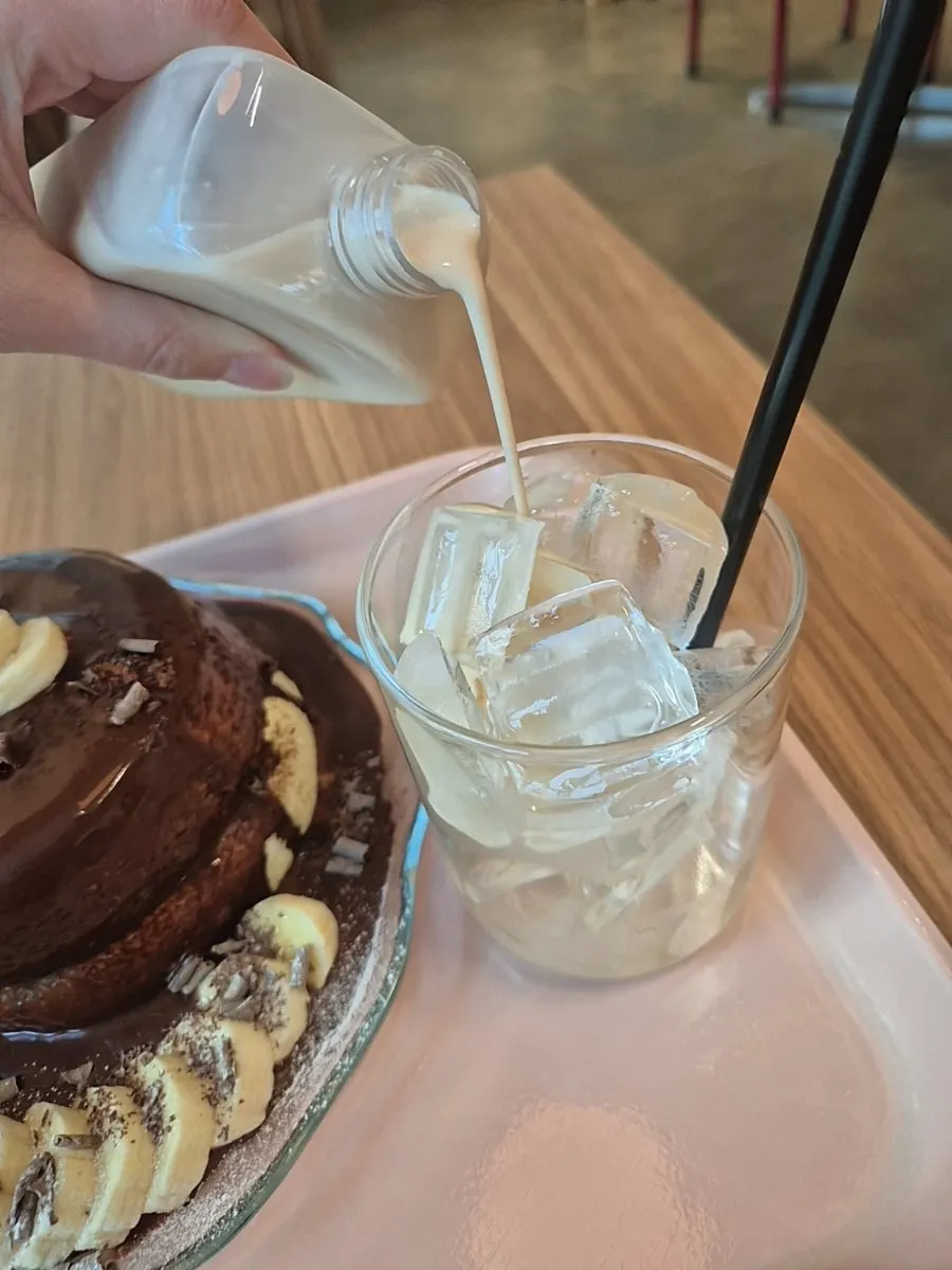 Cold-brewed alssam milk tea served in a reusable bottle